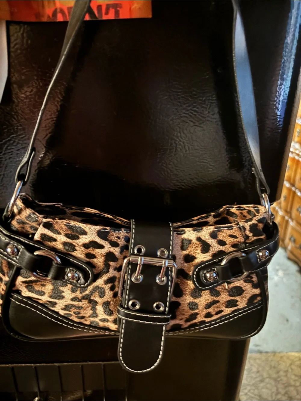 Leopard Print Shoulder Bag with Black Trim and Buckle Accent
